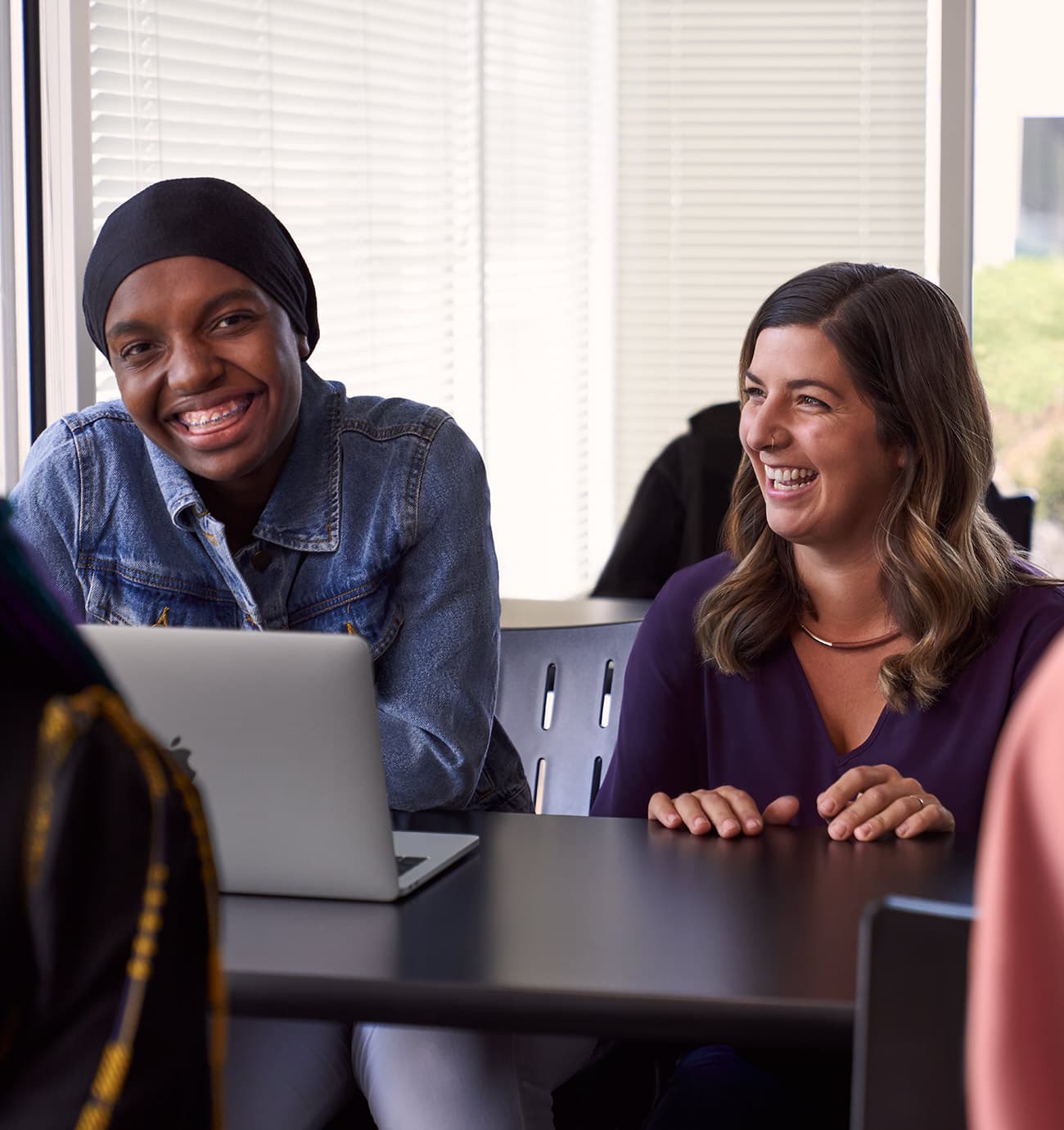 A student and tutor smiling together during a lesson